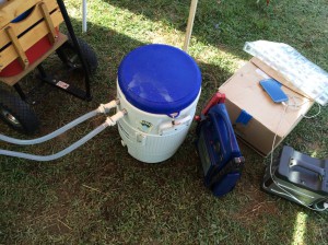 Ice and water filled cooler with a 12v bilge pump pushing cold water to cool.