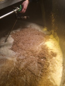 Checking the mash after all the grain and water has been loaded